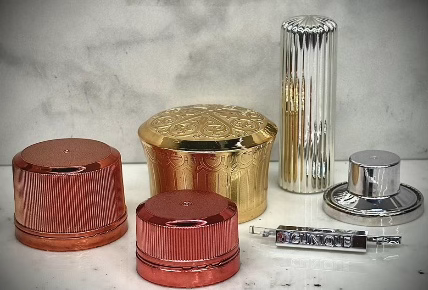 High-gloss metallized cosmetic compact and packaging caps and closures