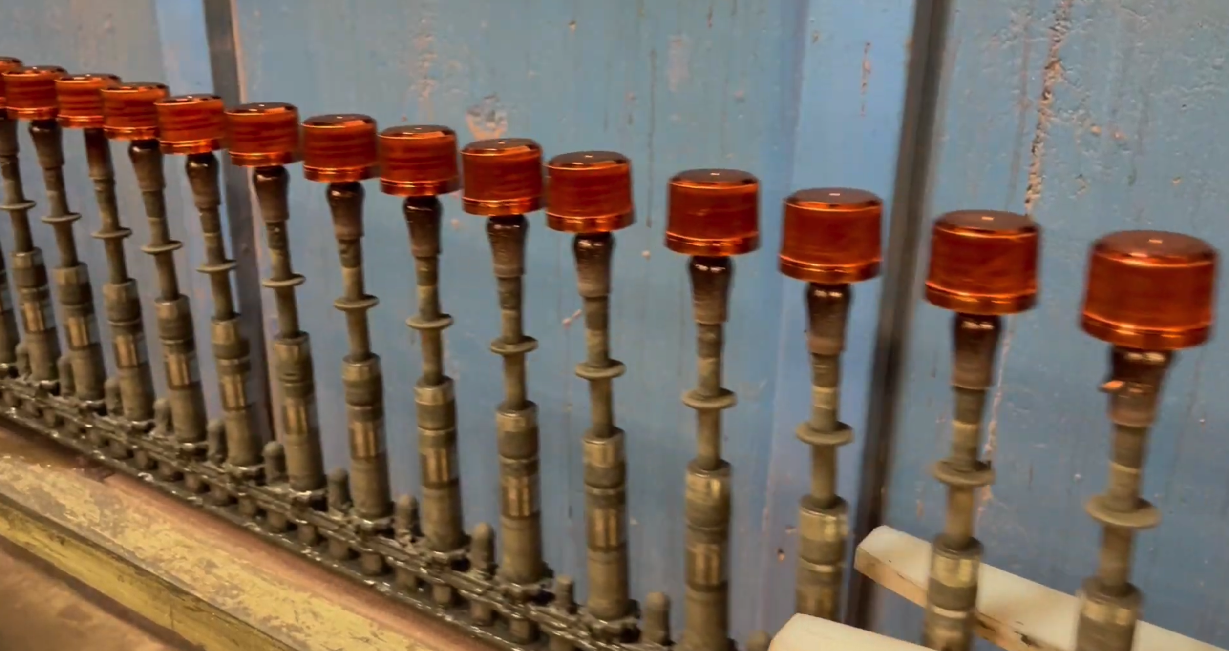 Providence Metallizing fully automated Bullet Line metallizing caps and closures with high-gloss finishes